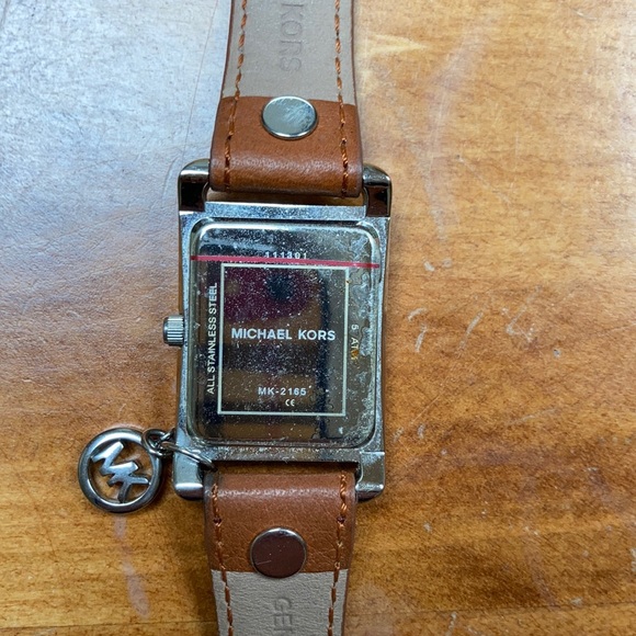 Michael Kors leather band women’s watch with charm